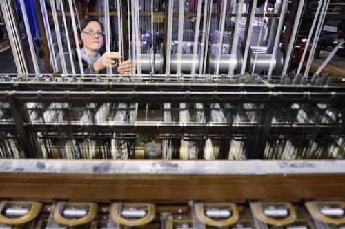 Photograph: Tim Smith | Through a loom in the weaving department at Wyedean Weaving. 